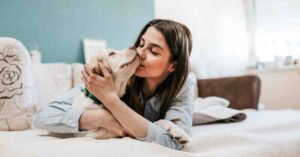 A cozy family moment with a playful dog, capturing the joy of connecting with loved ones beyond the clinic.